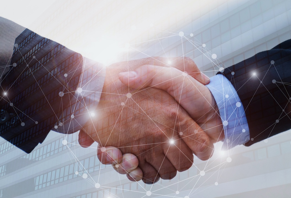 double exposure of business man handshake on modern office building background with network connection graphic diagram, partnership business,  teamwork global, technology and digital internet concept